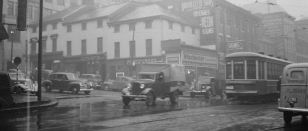 The intersection of Saint Lawrence Boulevard and Craig Street on a rainy day in October 1941. Photographed by Conrad Poirier. Photo courtesy Pistard/BAnQ (P48,S1,P6888)