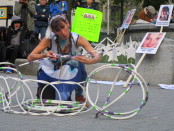 Hoop dancer "cradling baby". Missing and Murdered Aboriginal Women March and Vigil. Photo Rachel Levine