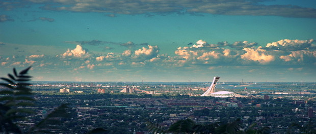 View of Montreal on a clear day. Note the Olympic Stadium to the right. Photo credit: Antoine Mghayar/Wikimedia Commons.