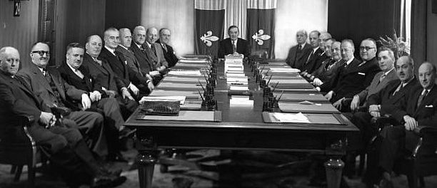 The 1954 Maurice Duplessis cabinet. Note the Québec flag in the background.