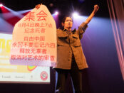 Woman holding up Chinese poster