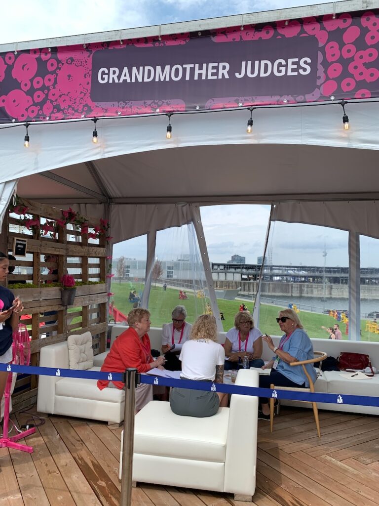 People pitching ideas under Grandmother tent