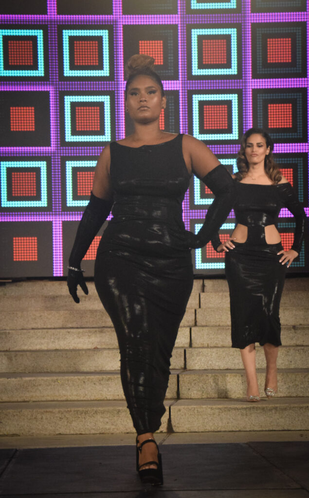 women modelling black dresses