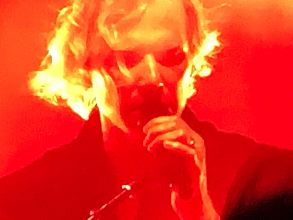 Rufus del Sol singing in red light. Osheaga. 2023. Photo Rachel Levine.