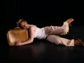 Woman Lying with Suitcase