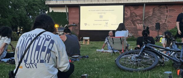 People watching a movie outside