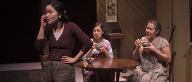 Three women from China with blood on their shirts.