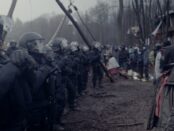 Police face off against activists in foggy bleak area