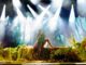 singer on stage with swamp theme