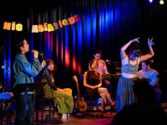 People performing on stage and dancing