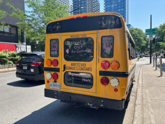 School bus with writing to indicate school is over for the year